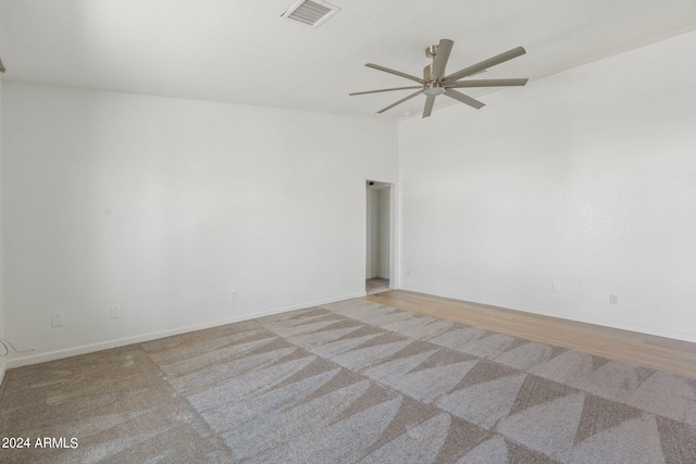 unfurnished room with ceiling fan and light hardwood / wood-style floors