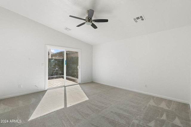 unfurnished room featuring light carpet, vaulted ceiling, and ceiling fan