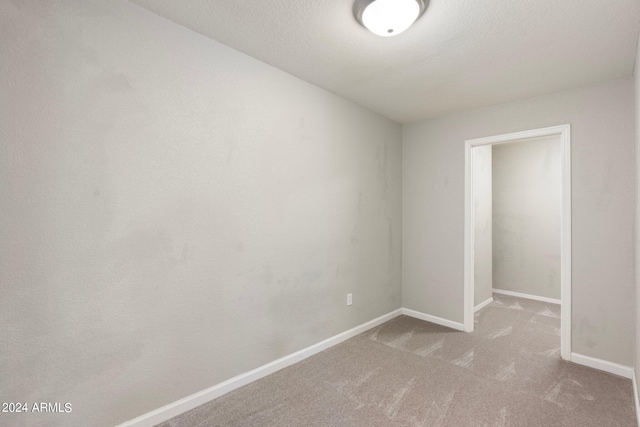 empty room featuring carpet flooring