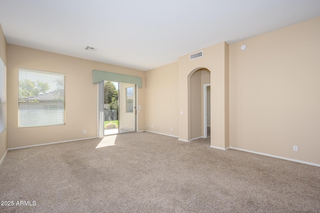 empty room featuring light carpet