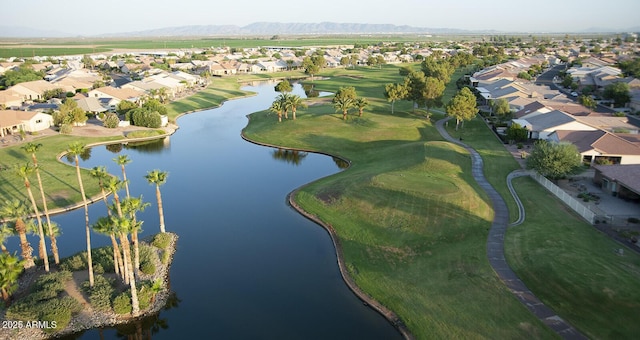 drone / aerial view with a water and mountain view