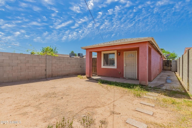 view of outbuilding featuring a fenced backyard