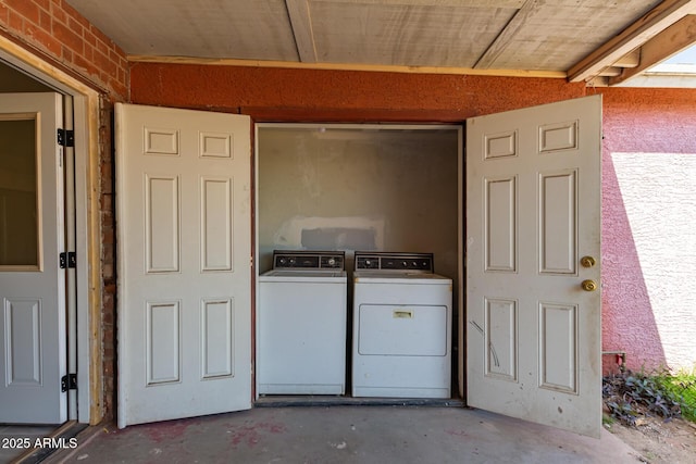 laundry area with laundry area and washer and clothes dryer