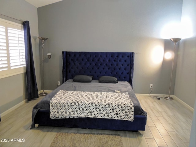 bedroom featuring light wood-type flooring