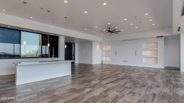 15217 N 15th Dr, Phoenix, AZ 85023 - unfurnished living room with built in features, baseboards, visible vents, and recessed lighting