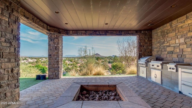15217 N 15th Dr, Phoenix, AZ 85023 - view of patio with exterior kitchen, a mountain view, and a grill