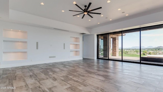 15217 N 15th Dr, Phoenix, AZ 85023 - unfurnished room featuring baseboards, recessed lighting, built in features, and a mountain view