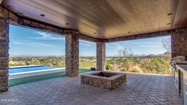 15217 N 15th Dr, Phoenix, AZ 85023 - view of patio featuring an outdoor pool, a fire pit, and a mountain view