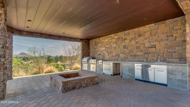 15217 N 15th Dr, Phoenix, AZ 85023 - view of patio with a sink, exterior kitchen, a grill, and a mountain view