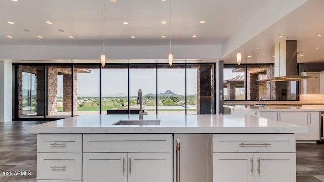 15217 N 15th Dr, Phoenix, AZ 85023 - kitchen featuring a mountain view, island exhaust hood, a sink, white cabinets, and recessed lighting