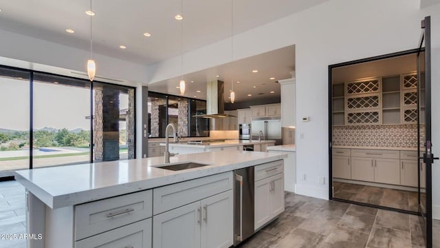 15217 N 15th Dr, Phoenix, AZ 85023 - kitchen featuring a sink, a large island, pendant lighting, island range hood, and decorative backsplash