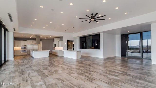 15217 N 15th Dr, Phoenix, AZ 85023 - unfurnished living room featuring visible vents, a ceiling fan, and recessed lighting