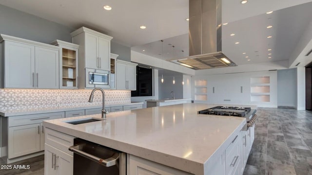 15217 N 15th Dr, Phoenix, AZ 85023 - kitchen with a center island, island exhaust hood, a sink, stainless steel appliances, and tasteful backsplash
