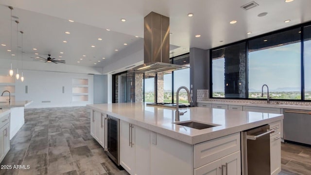 15217 N 15th Dr, Phoenix, AZ 85023 - kitchen with beverage cooler, visible vents, a healthy amount of sunlight, and a sink