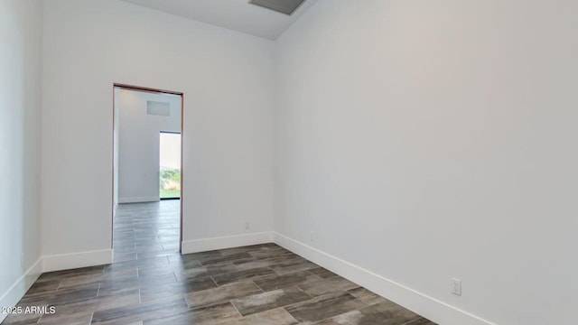 15217 N 15th Dr, Phoenix, AZ 85023 - empty room with wood finished floors, visible vents, and baseboards