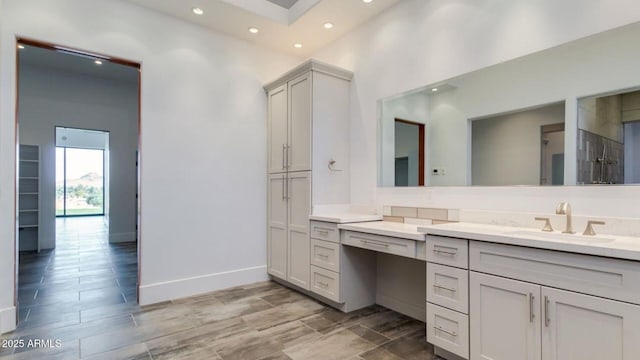 15217 N 15th Dr, Phoenix, AZ 85023 - bathroom with baseboards, vanity, recessed lighting, and wood finish floors