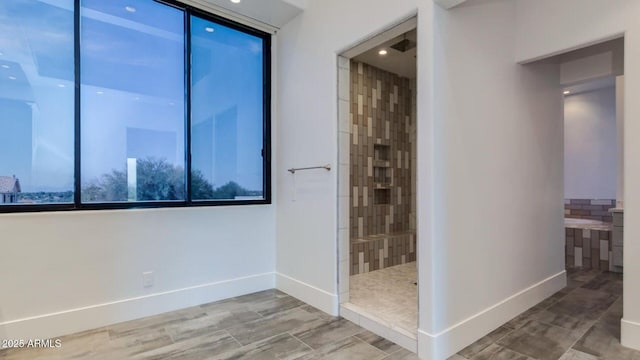 15217 N 15th Dr, Phoenix, AZ 85023 - full bathroom featuring baseboards and tiled shower