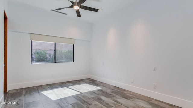 15217 N 15th Dr, Phoenix, AZ 85023 - unfurnished room featuring baseboards, a ceiling fan, visible vents, and wood finished floors