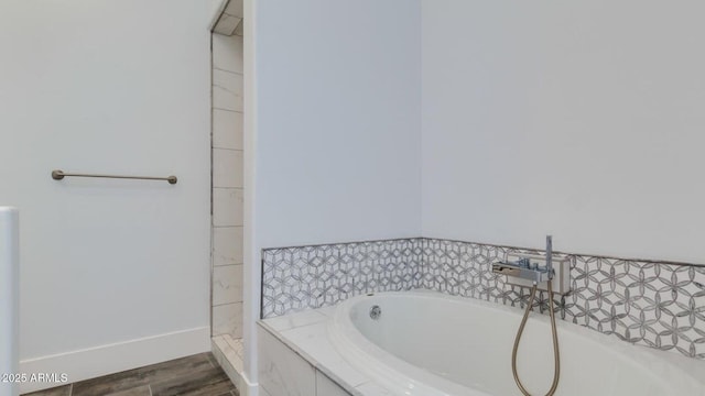 15217 N 15th Dr, Phoenix, AZ 85023 - full bathroom featuring a garden tub, baseboards, and wood finished floors