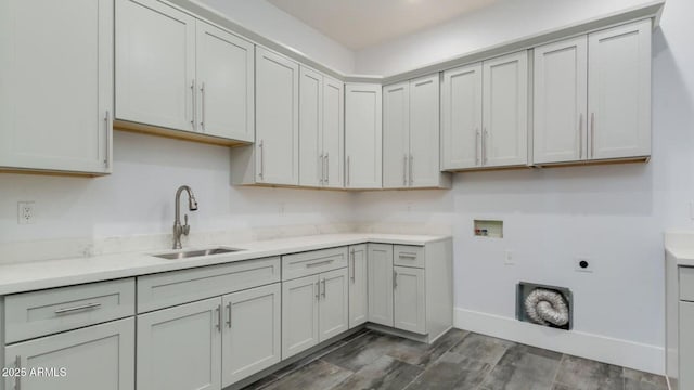 15217 N 15th Dr, Phoenix, AZ 85023 - laundry room featuring a sink, cabinet space, washer hookup, hookup for an electric dryer, and baseboards