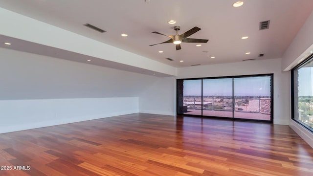 15217 N 15th Dr, Phoenix, AZ 85023 - spare room featuring recessed lighting, a ceiling fan, visible vents, and wood finished floors