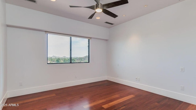 15217 N 15th Dr, Phoenix, AZ 85023 - empty room with wood finished floors, baseboards, ceiling fan, and recessed lighting