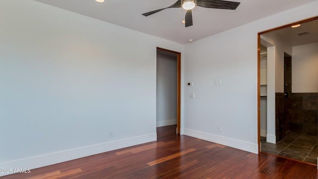 15217 N 15th Dr, Phoenix, AZ 85023 - empty room featuring baseboards, wood finished floors, and a ceiling fan