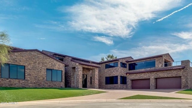 15217 N 15th Dr, Phoenix, AZ 85023 - view of front facade featuring an attached garage, driveway, a front lawn, and stone siding