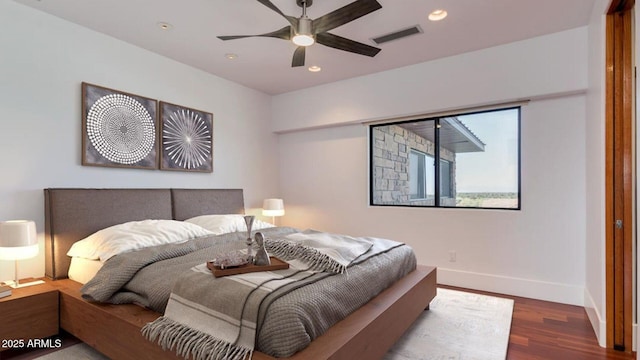15217 N 15th Dr, Phoenix, AZ 85023 - bedroom featuring wood finished floors, visible vents, baseboards, ceiling fan, and recessed lighting