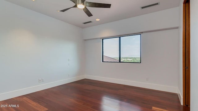 15217 N 15th Dr, Phoenix, AZ 85023 - spare room with baseboards, a ceiling fan, visible vents, and wood finished floors