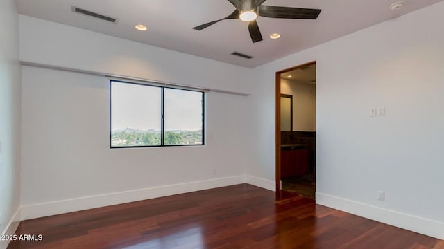 15217 N 15th Dr, Phoenix, AZ 85023 - unfurnished room featuring baseboards, a ceiling fan, visible vents, and wood finished floors