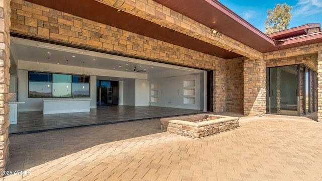 15217 N 15th Dr, Phoenix, AZ 85023 - entrance to property with stone siding, a patio, driveway, and a garage