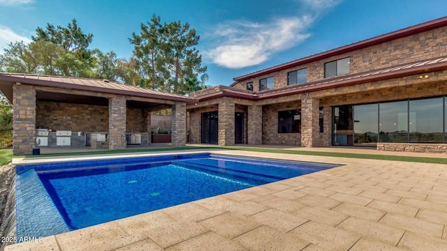 15217 N 15th Dr, Phoenix, AZ 85023 - pool with a patio area and exterior kitchen