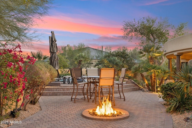 view of patio / terrace with a fire pit