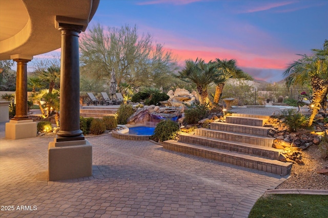 view of property's community featuring a patio