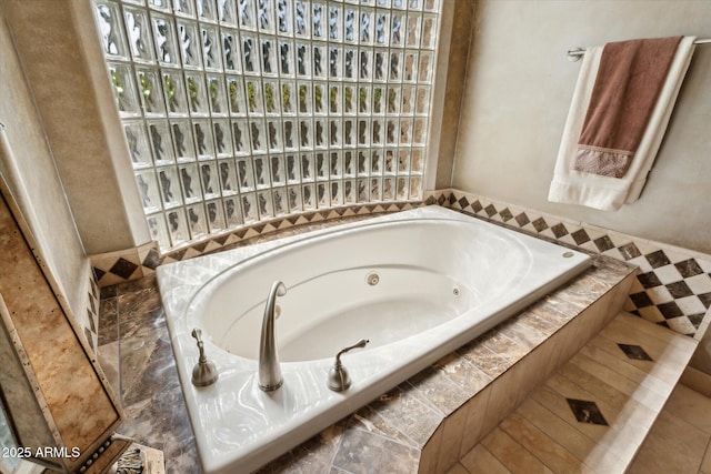 bathroom with a whirlpool tub