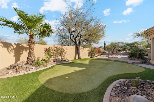 view of yard featuring a patio and a fenced backyard