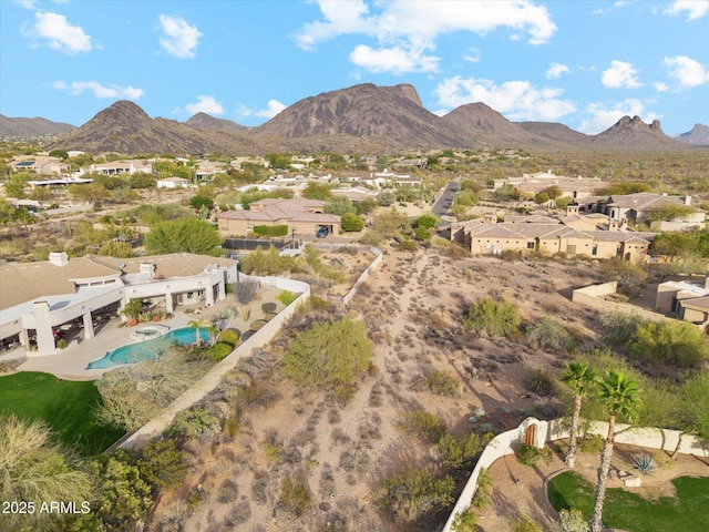 drone / aerial view featuring a residential view and a mountain view