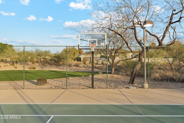 view of basketball court featuring community basketball court and fence