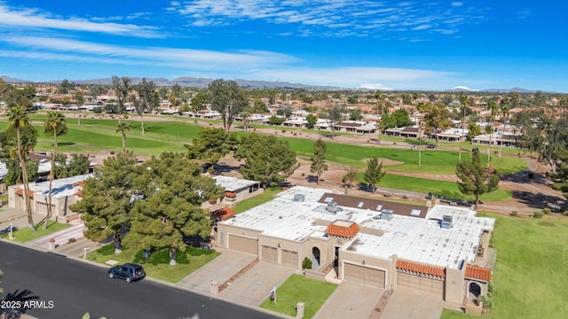 bird's eye view with view of golf course and a residential view