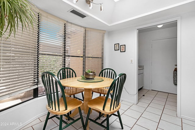 dining area with light tile patterned flooring, visible vents, and baseboards