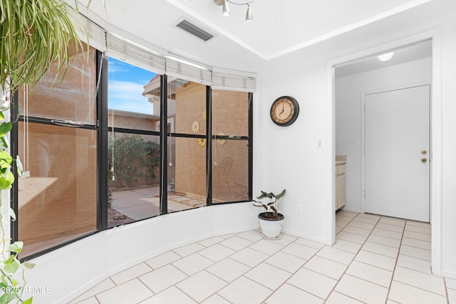 interior space featuring tile patterned floors, baseboards, and visible vents