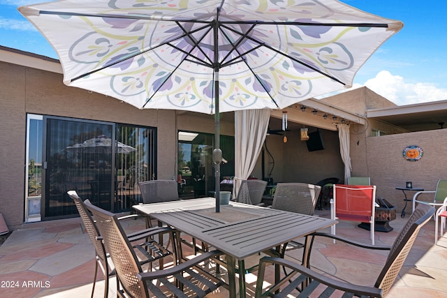 view of patio featuring outdoor dining area