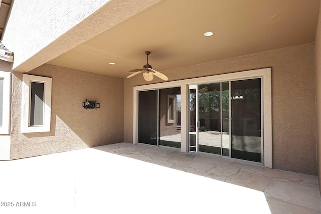 view of patio featuring ceiling fan