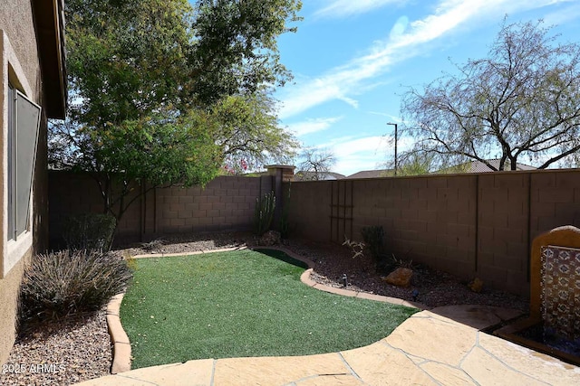 view of yard featuring a fenced backyard