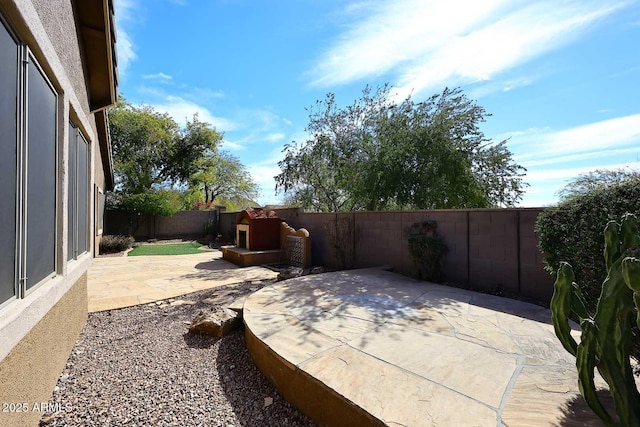 view of patio with a fenced backyard