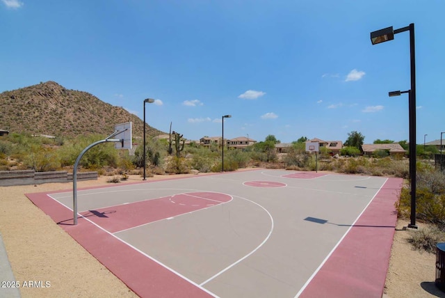 view of basketball court with community basketball court and a mountain view