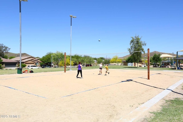 view of home's community featuring volleyball court