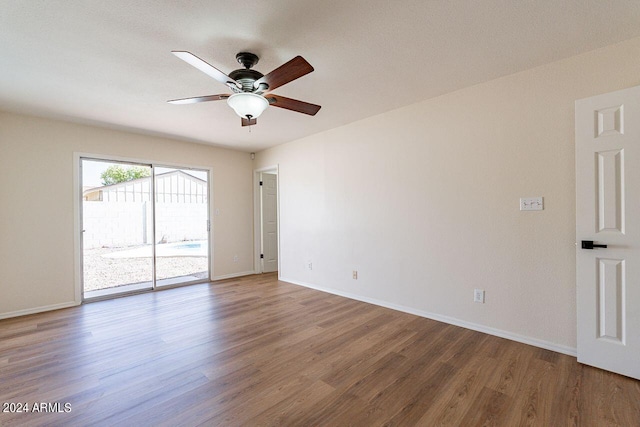 unfurnished room with wood-type flooring and ceiling fan