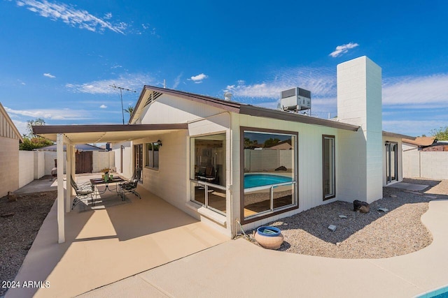 back of house with a patio area